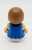Playmates Li'l Playmates - Female with Blue Dress and Brown Hair, front view of the toy figure with detailed textured hair and colorful clothing.