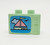 Lego LEGO Duplo Utensil Brick 1 x 2.5 x 1.3 Television with Ship Pattern, pastel green toy brick with a printed ship and sea scene, designed for children's building blocks.