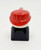 Lego LEGO Duplo 2x2x2 Male on Black Base with Mustache Red Hat (Firefighter) Brick Figure, close-up of a small red firefighter Lego figure with a mustache and red hat on a black stand.
