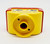 Lego DUPLO Figure Head 2 x 2 Base with Red Hair, Freckles, Eyes Looking Left, yellow color, cartoon face design.