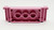 Lego LEGO DUPLO Furniture Couch / Sofa 2 x 6 - Medium Dark Pink, a pink plastic Lego DUPLO furniture piece with a couch design and open slots for assembly.