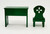 Calico Critters EPOCH 1985 Sylvanian Families Calico Critters - Desk and Chair, small green wooden furniture set with a rectangular desk and a matching chair featuring a cut-out flower shape in the backrest.
