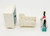 Fisher-Price Doll House Decorator Set #257 Baby's Room, including a small white cabinet, a miniature baby crib with a patterned sheet, and a toy rocking horse with a saddle.