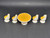 Fisher-Price doll house decorator set #251 Dinette Set. The dinette set features 1970's yellow and white table and chair set. The round table has white base with yellow top. The four high back chairs are white with yellow cushions.