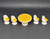 Fisher-Price doll house decorator set #251 Dinette Set. The dinette set features 1970's yellow and white table and chair set. The round table has white base with yellow top. The four high back chairs are white with yellow cushions.