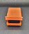 Fisher-Price Doll House lounge chair from the patio furniture decor.  The orange lounge chair was available in multiple sets 1979 - 1984.  The back of the lounger raises to replicate a real chair.