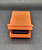 Fisher-Price Doll House (1978 - 1985) Lounge Chair, vintage orange toy lounge chair with a built-in drawer underneath for storage.