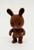 Tomy Sylvanian Family Vintage Wildwood Brown Rabbit Family - Rusty Wildwood, plush toy rabbit with brown fur, standing on a white background.