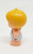 Kenner Tree Tots 1976 Campy Tree Tot, vintage plastic toy figure with a large yellow shell-shaped hairdo and striped outfit.