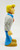 Thinkway Toys Hanna-Barbera Scooby-Doo Fred Jones Action Figure, side view of the toy figure of Fred Jones with blonde hair, white shirt, blue pants, brown shoes, and standing against a plain white background.