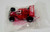 Mattel 1991 Hot Wheels 1/64 Nintendo FX Race Car, packaged toy car inside a clear plastic bag with red detailing and black wheels.