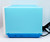 Tyco TYCO 1990 Real Cookin' Watch It Bake Oven, blue toy electric oven with power cord visible.