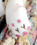 Liberty of London Authentic Victorian 18" Doll Wearing Tana Lawn Liberty of London Dress, detailed close-up of the doll's white ceramic body with pink polka dots and black painted floral design.