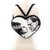 Sleepyville Critters Glow in the Dark Heart Shape Frankenstein & Bride Backpack, a spooky Halloween accessory and convertible crossbody bag featuring a black and white illustration of Frankenstein and Bride inside a glowing heart-shaped outline.