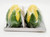 DOLGENCORP Inc. Dolgencorp Corn on the Cob Shaped Salt & Pepper Shakers, set of two corn-shaped salt and pepper shakers in green and yellow, wrapped in plastic packaging.