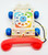 Fisher-Price 1985 Chatter Telephone, vintage plastic toy telephone with colorful dial, blue wheels, red handset, and decorative star patterns.
