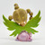 The Hamilton Collection 2013 Crystal Reflections of Hope Collection Courage Shines, a figurine featuring a girl with styled blonde hair in pigtails, sitting on a pink base with green glittery wings.