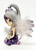 The Hamilton Collection 2014 Enchanting Companions Midnight Dream, a collectible figurine featuring a young fairy with large gray eyes, silver hair styled in a high ponytail with purple accents, and delicate feathered wings with purple and glitter details, wearing a purple dress with moon motifs and striped socks.
