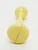 Unbranded Vintage 4-inch Plastic Yellow Baby Rattle, front view of the yellow plastic baby rattle with a round head and a handle.