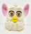 McDonald's Happy Meal Toy 1999 McFurby Series 5 - #9 White/White, a collectible Furby figure with pink ears, large eyes with eyelashes, and a yellow beak.
