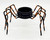 Unbranded Halloween Black and Orange Metal Spider Tea Light Votive Candle Holder, spider-shaped decorative candle holder for Halloween.