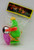 W.D. Vintage W.D. Jumping Animal Toy - Monkey With Cymbals, colorful plastic toy figurine of a monkey holding cymbals, with a picture of the toy on its packaging.