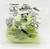 Hardee's 2000 Godzilla The Series Leaking Lizards Squirter Toy, shown in a transparent plastic bag with black and green printing and illustrations of Godzilla characters and features.