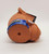 Camel Cigarettes 1991 Joe Camel Smooth Character Can Koozie, brown rubber can koozie featuring Joe Camel with a cigarette in his mouth, blue branding band around the bottom with yellow text.