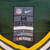 NFL Green Bay Packers #12 Aaron Rodgers Nike Jersey, close-up view of the on-field label showing size M, made in Honduras, and NFL Players branding.