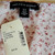 Saks Fifth Avenue Women's Floral Ruffle Blouse Lilac/Rose, close-up of fabric with pink floral pattern and tags.