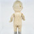 Unbranded Antique Composition 13.5" Blonde Hair Girl Doll, front view showing worn and aged porcelain doll with a bald head, chipped paint, and vintage appearance.