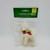 King Importing Inc. Holiday Cheer Winter Wonderland Unicorn Christmas Ornament, plush white unicorn with a red and green ribbon, inside a clear plastic bag with a green and yellow label.