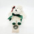 Boyds Bears Charity Angelbeary, plush white teddy bear with green accents, wearing a green ribbon bow and holiday decoration around its head.