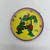 Mirage Studios Teenage Mutant Ninja Turtles Raphael Ball in Hole Party Favor Game, colorful circular game with Raphael turtle character illustration and metal balls.