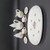 Royal Norfolk Miniature Porcelain Tea Set For Two - Rose, with a teapot, sugar bowl, creamer, two cups, and a serving tray, all decorated with pink roses and green leaves.