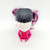 McDonald's Happy Meal Toy 2015 Monster High #6 Make Up Artist Toy, front view of a stylized doll with black and pink hair in pigtails, wearing a pink outfit, on a white background.