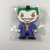 Funko Luggage Tag - DC Comics The Joker, cartoonish Joker character with green hair, white face, purple suit, and a wide grin, in sealed plastic packaging.