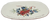 Lenox Winter Greetings collection Christmas serving platter with a cardinal on sprigs of holly with "All Roads Lead Home At Christmas".  The 14-inch serving platter has red edge with embossed sprigs of holly on each end.