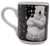 Gibson 1996 Coca-Cola ceramic mug featuring a Polar Bear with arms crossed holding a bottle of Coca-Cola.  The polar bear is wearing jeans with Coca-Cola waist band with a black background with yellow stars.