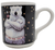 Gibson 1996 Coca-Cola ceramic mug featuring a Polar Bear with arms crossed holding a bottle of Coca-Cola.  The polar bear is wearing jeans with Coca-Cola waist band with a black background with yellow stars.