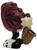 CALRAB California Raisins 1987 California Raisins Original Saxophone Player PVC Toy Figure, vintage cartoon-style figurine of a raisin playing saxophone with black, white, and gold accents.