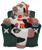 Novelty Christmas candle of a Holstein cow wearing Santa hat and red and white stripped scarf while sitting in a green chair. The cow is also wearing gold sunglasses and holding a red mug in arms. The single wick candle is by Boston Warehouse Trading Corp and was made in China.