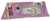 Small duck pull back toy by Easter Unlimited. The duck is white with pink wings and green tires. The duck is 1.5-inches long and stands 1.5-inches tall and for ages 3 & Up.