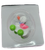 Small duck pull back toy by Easter Unlimited. The duck is white with pink wings and green tires. The duck is 1.5-inches long and stands 1.5-inches tall and for ages 3 & Up.