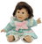 Gi-Go toys brunette girl doll with 2 teeth that measure 11-inches long. The doll has soft Polyester fiber body with rubber head, feet and hands. She is wearing light blue dress with white and pink spots. The dress has pink ribbon and white trim and a white pants under the dress.
