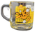 McDonald's 1978 glass coffee cup of Garfield saying "This Is The Only Alarm Clock I Need To Set" & "The early cat gets the hotcake" with yellowed checkered background.