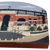 Camden Yards, the home of the MLB Baltimore Orioles wood shelf sitter decor. The IMAGIMAX product features painted front entrance of Camden Yards and is 7-inches wide x 4.75-inches tall. You can set this on any flat surface or use something to adhere the piece to the wall.