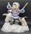 What a Catch! figurine features a Eskimo boy holding fish at his fishing hole with 2 penguins in front of him. The boy is wearing blue pants  and purple jacket holding his fishing rod. The figurine is a hand painted porcelain figurine crafted in Malaysia. Michelle Emblem's figurine is 6.5-inches wide by 7-inches tall and 5-inches deep.