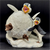 Whoa! figurine features a penguin inside a snowball with 2 penguins beside him. The figurine is a hand painted porcelain figurine crafted in Malaysia. Michelle Emblem's figurine is 6-inches wide by 6-inches tall and 5-inches deep.