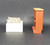 Fisher-Price doll house decorator set #254 Chair and Fireplace.  The chair and fireplace set includes a plastic fireplace and FPT5022 white plastic square chair with tan stuffed fabric cushion that fits the chair with muli-colored flowers.